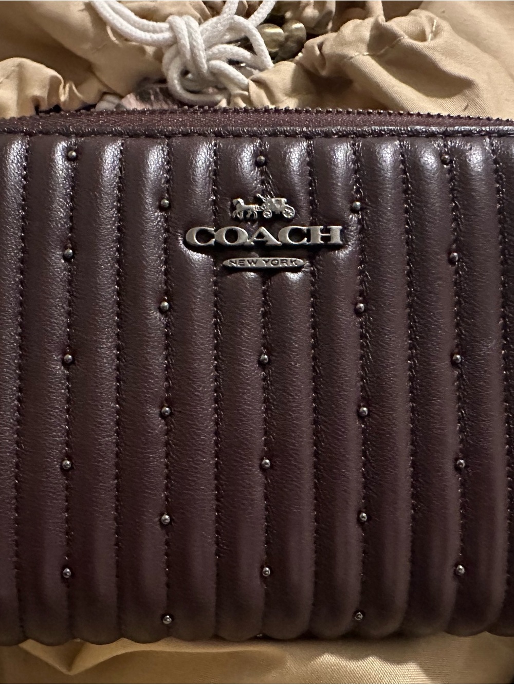 COACH Quilted Studded Leather Wristlet in Dark Brown